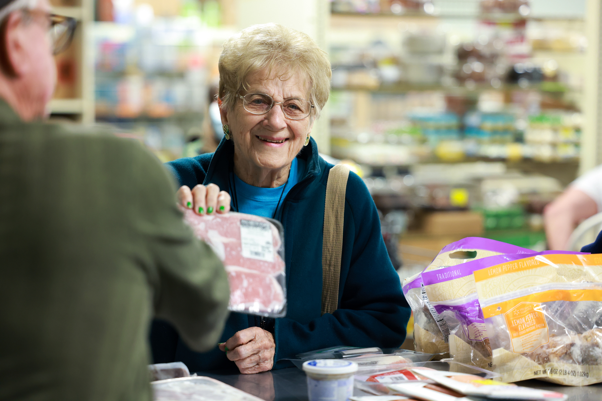 Lady at Meat Counter